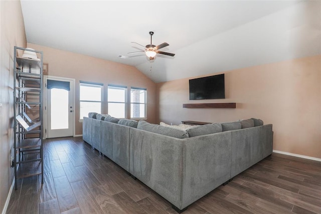 living room with lofted ceiling, a ceiling fan, baseboards, and dark wood-type flooring