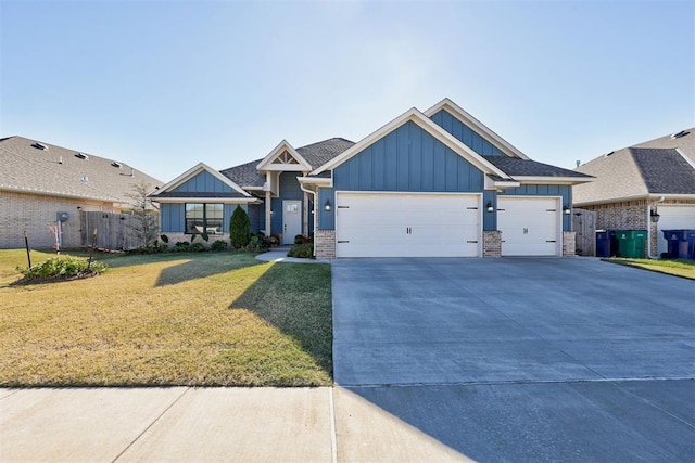 view of front facade featuring brick siding, concrete driveway, board and batten siding, a front yard, and a garage