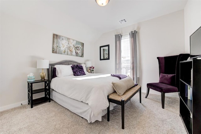 bedroom with light carpet, visible vents, baseboards, and lofted ceiling