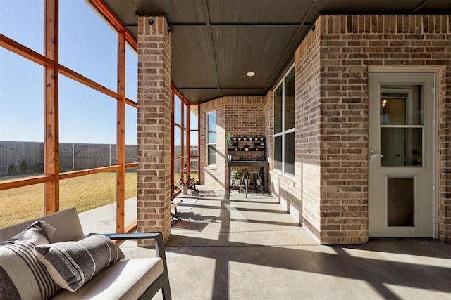 view of patio featuring fence