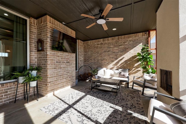 view of patio / terrace with an outdoor living space and a ceiling fan