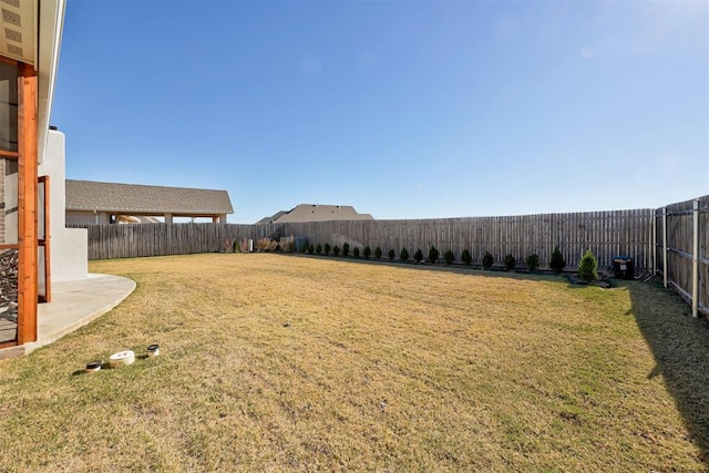 view of yard featuring a fenced backyard