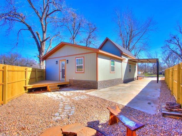 exterior space featuring a deck and a patio