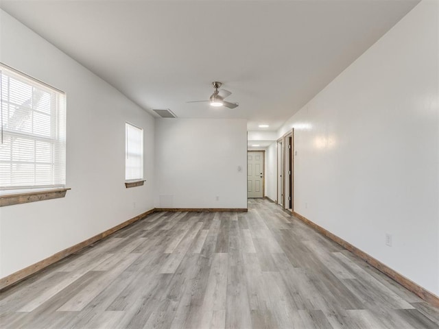 unfurnished room featuring ceiling fan and light wood-type flooring