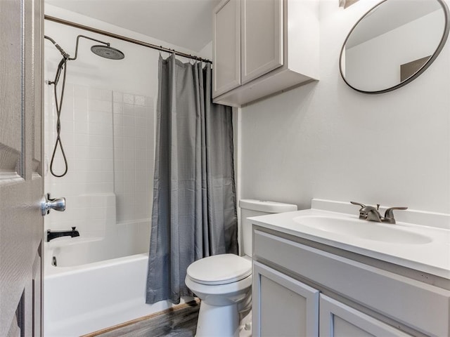 full bathroom featuring hardwood / wood-style flooring, shower / bath combo with shower curtain, vanity, and toilet