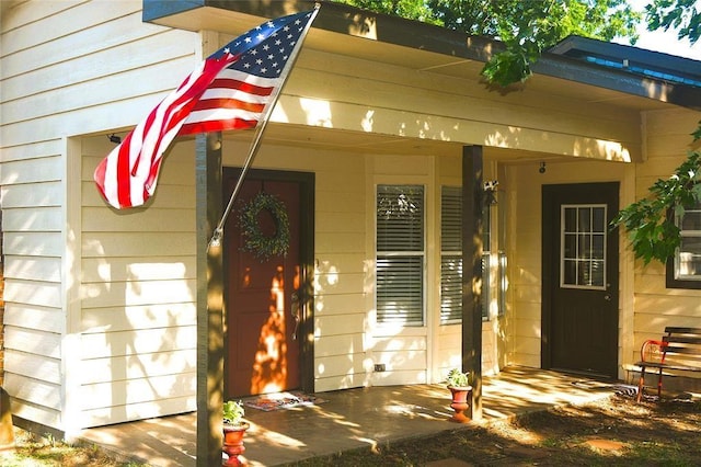 property entrance featuring covered porch