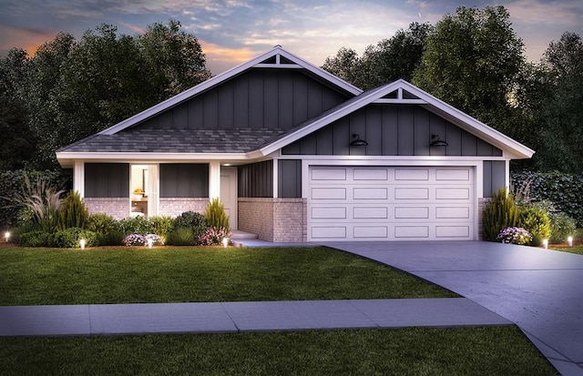 view of front of house featuring a garage, concrete driveway, a front lawn, board and batten siding, and brick siding