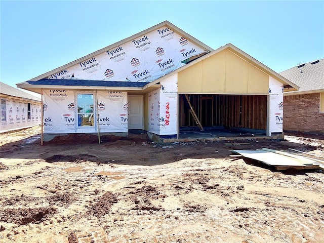 unfinished property featuring an outbuilding and a garage