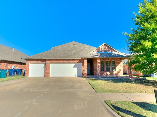 view of front facade with a garage and a front lawn