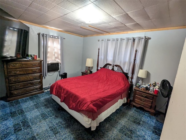 bedroom with dark carpet and cooling unit