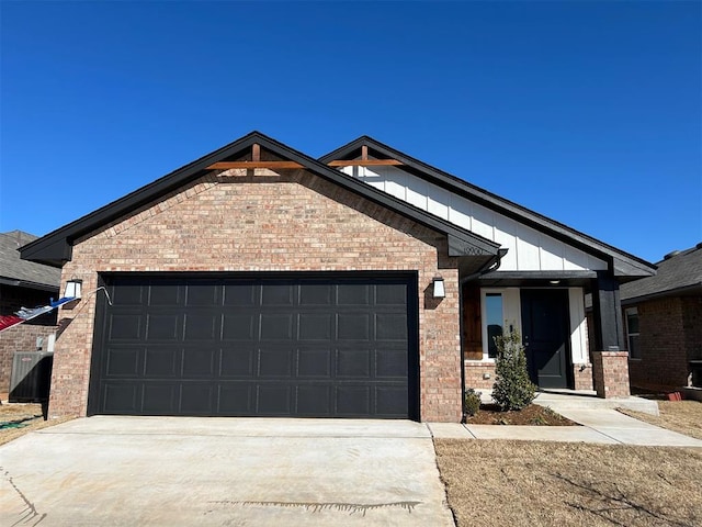 view of front of property with brick siding, concrete driveway, and a garage