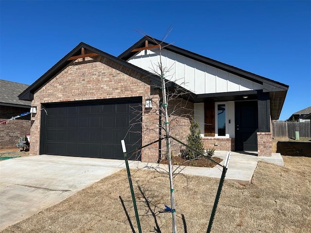 view of front of home with brick siding, an attached garage, and concrete driveway