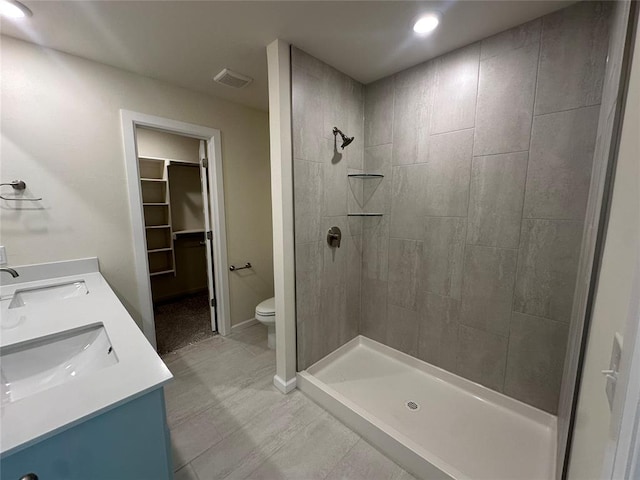 full bathroom with a sink, visible vents, and a shower stall