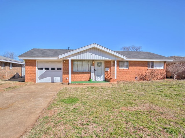 single story home featuring a garage, driveway, a front lawn, and brick siding