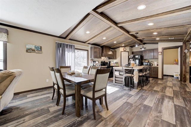 dining room with dark wood-type flooring, recessed lighting, lofted ceiling with beams, and baseboards