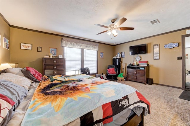 carpeted bedroom featuring crown molding, visible vents, a ceiling fan, a textured ceiling, and baseboards