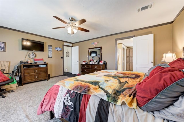 bedroom featuring ornamental molding, carpet flooring, visible vents, and baseboards