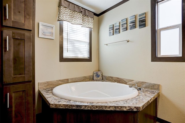 full bath featuring ornamental molding and a bath