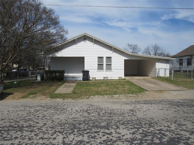 ranch-style home featuring a carport