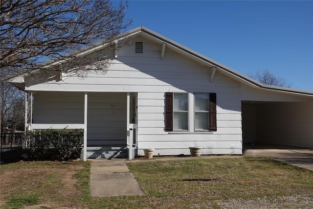 bungalow-style house with covered porch and a front lawn