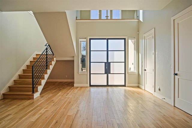 foyer entrance with light hardwood / wood-style flooring