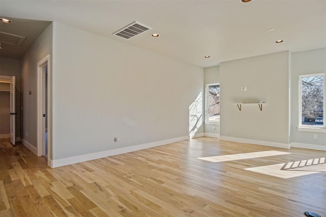 interior space with plenty of natural light and light hardwood / wood-style floors