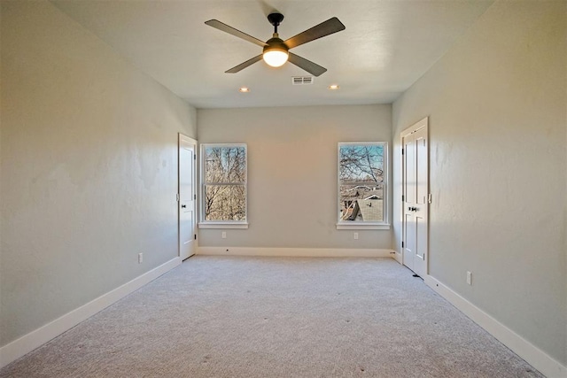 carpeted empty room with ceiling fan