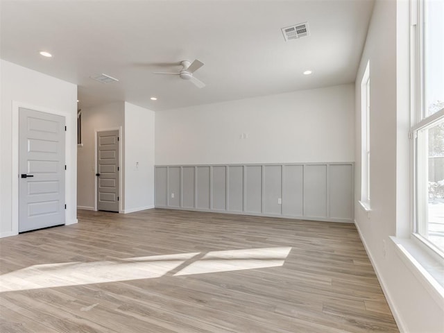 unfurnished room featuring light wood-style flooring, visible vents, a ceiling fan, and recessed lighting