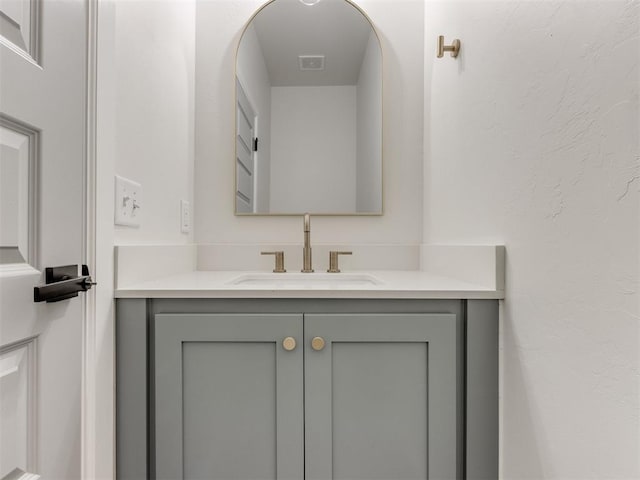 bathroom featuring visible vents and vanity