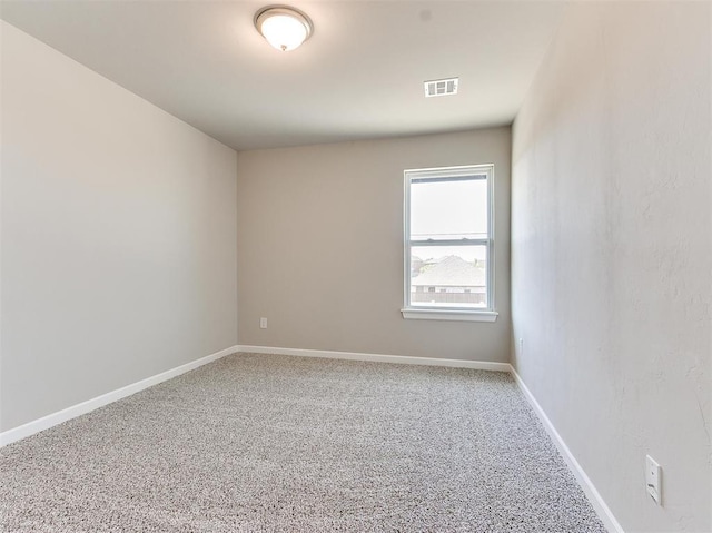 unfurnished room featuring carpet flooring