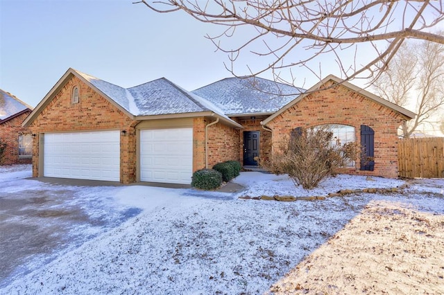 view of front of house with an attached garage, brick siding, a shingled roof, fence, and driveway