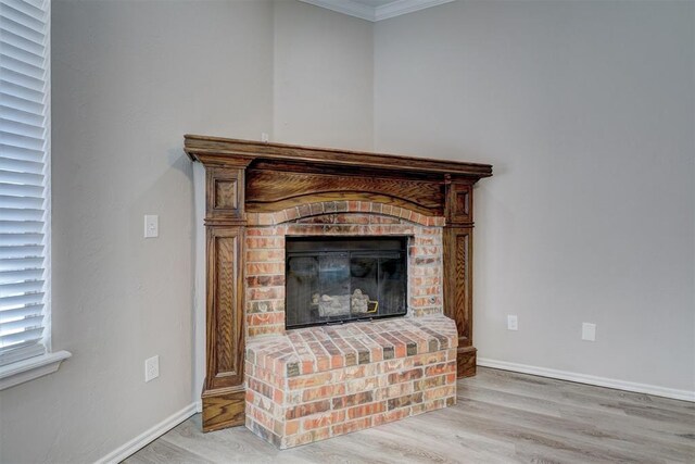8016 Heather Glen Dr, Yukon, OK 73099 - interior details with wood finished floors, a brick fireplace, crown molding, and baseboards