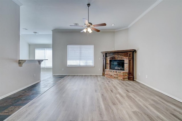 8016 Heather Glen Dr, Yukon, OK 73099 - unfurnished living room featuring ceiling fan, baseboards, ornamental molding, and a brick fireplace
