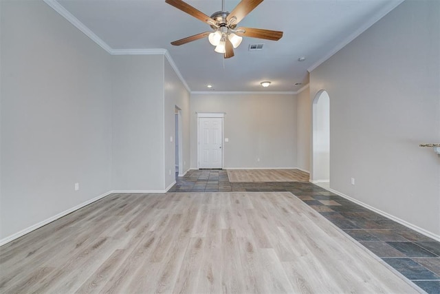 8016 Heather Glen Dr, Yukon, OK 73099 - unfurnished room with arched walkways, visible vents, baseboards, a ceiling fan, and ornamental molding
