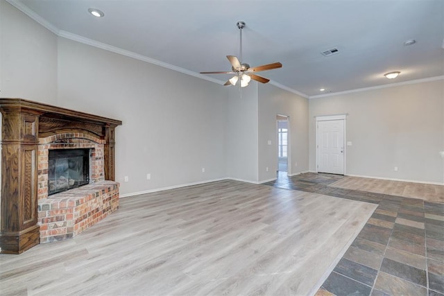 8016 Heather Glen Dr, Yukon, OK 73099 - unfurnished living room featuring visible vents, recessed lighting, wood finished floors, ceiling fan, and crown molding