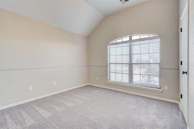 8016 Heather Glen Dr, Yukon, OK 73099 - unfurnished room featuring lofted ceiling, baseboards, carpet flooring, and visible vents