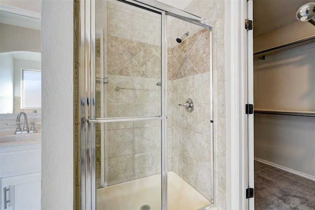 8016 Heather Glen Dr, Yukon, OK 73099 - full bathroom with vanity, a shower stall, and a walk in closet
