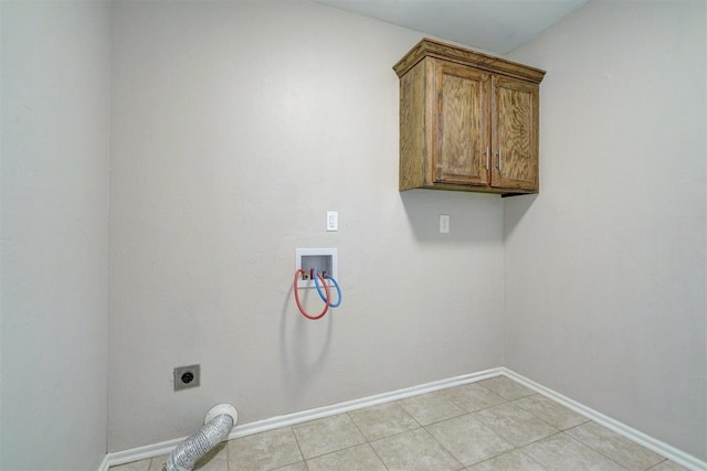 8016 Heather Glen Dr, Yukon, OK 73099 - laundry room featuring baseboards, washer hookup, cabinet space, electric dryer hookup, and light tile patterned floors