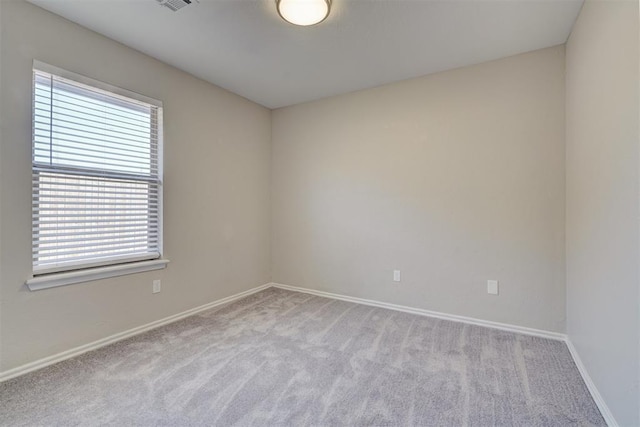 8016 Heather Glen Dr, Yukon, OK 73099 - unfurnished room featuring carpet floors, visible vents, and baseboards