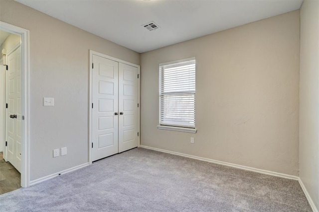 8016 Heather Glen Dr, Yukon, OK 73099 - unfurnished bedroom featuring visible vents, baseboards, carpet, and a closet