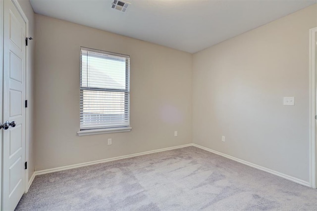 8016 Heather Glen Dr, Yukon, OK 73099 - empty room with carpet floors, visible vents, and baseboards
