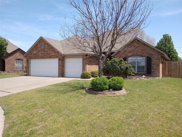 8016 Heather Glen Dr, Yukon, OK 73099 - ranch-style home with an attached garage, brick siding, fence, and driveway