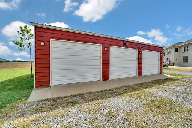 garage featuring a yard