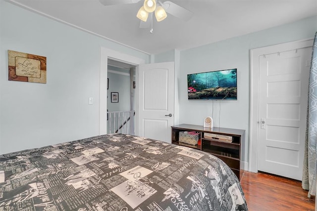 bedroom with ceiling fan and hardwood / wood-style floors