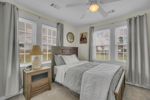 bedroom featuring light colored carpet and ceiling fan