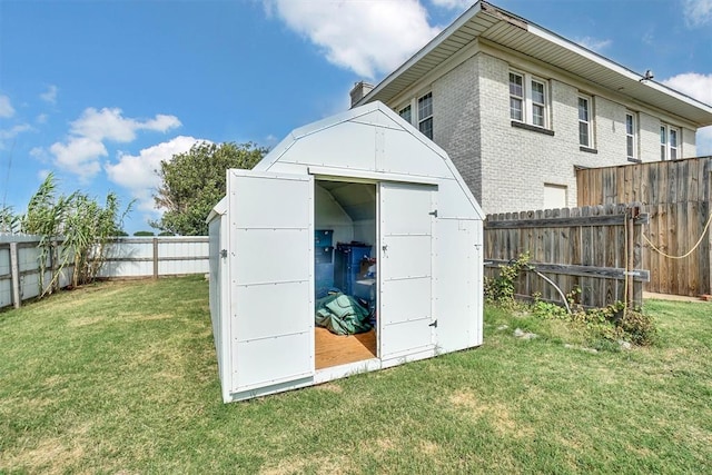 view of outdoor structure with a lawn