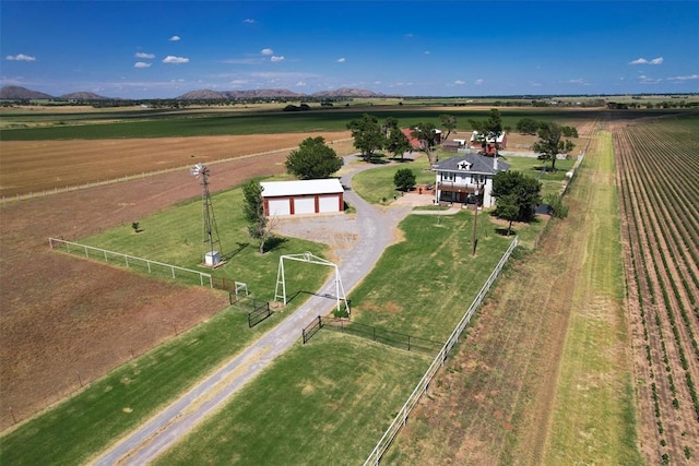 birds eye view of property with a rural view