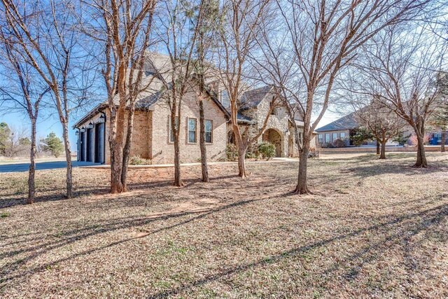 3910 Sienna Rdg, Newcastle, OK 73065 - view of yard featuring driveway and an attached garage