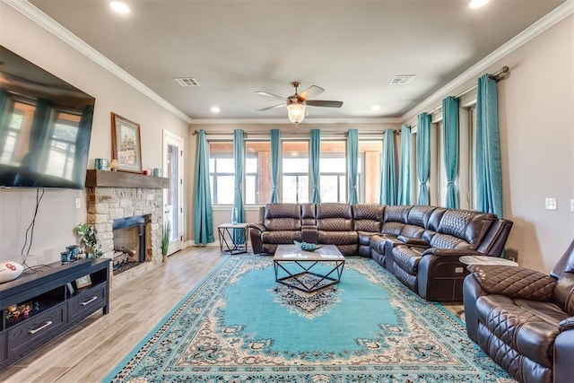 3910 Sienna Rdg, Newcastle, OK 73065 - living room with visible vents, crown molding, light wood-style flooring, and ceiling fan