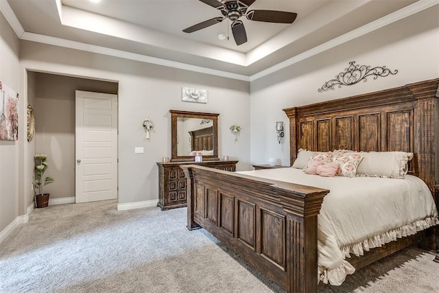 3910 Sienna Rdg, Newcastle, OK 73065 - bedroom featuring a tray ceiling, crown molding, light colored carpet, baseboards, and a ceiling fan